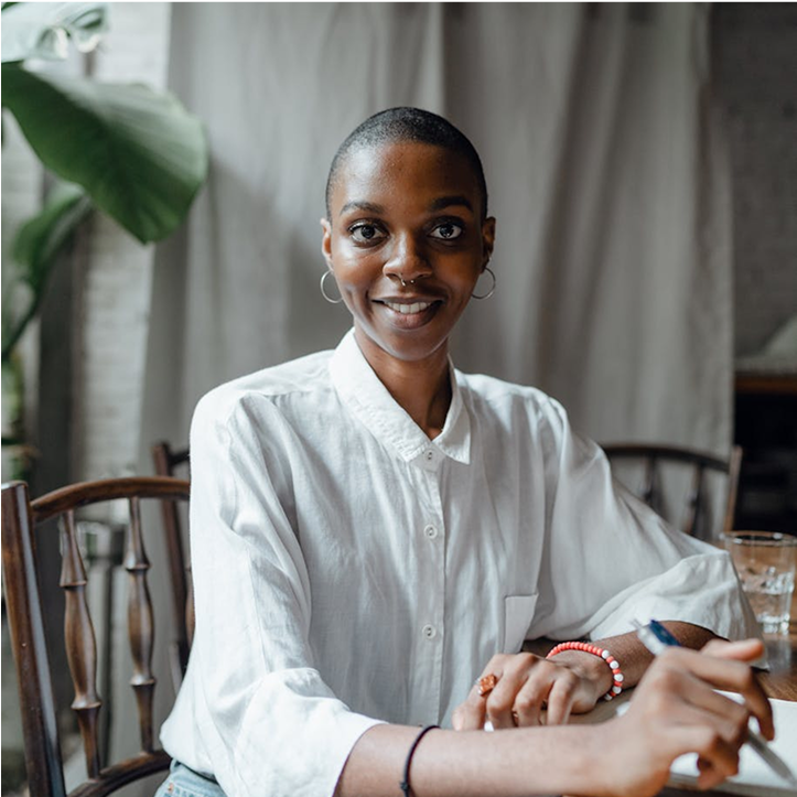 a proud individual sitting at a desk