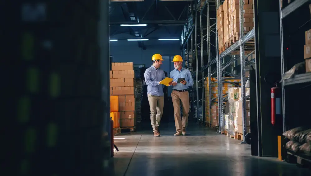 two men in a warehouse